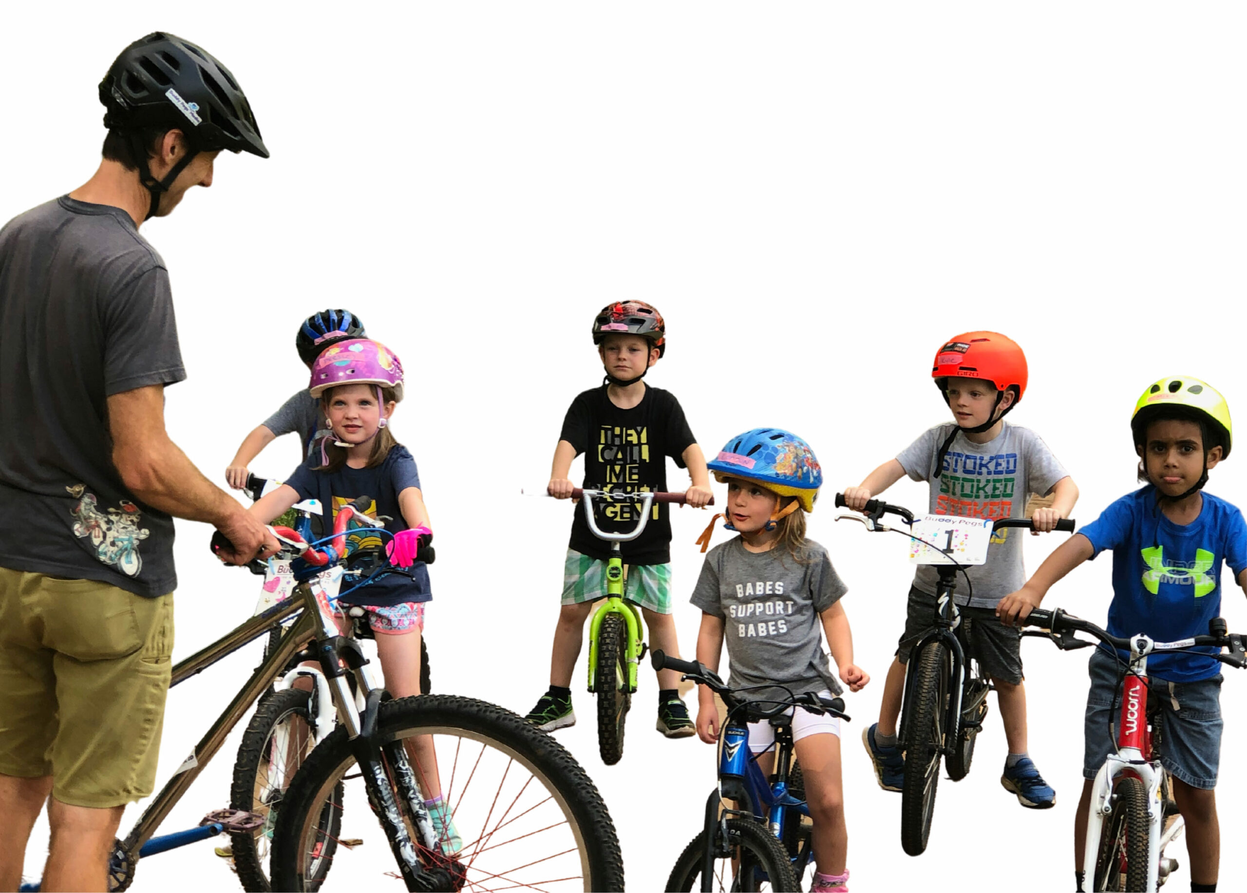 Bike coach with young children on bikes in a bike class